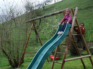 two children on a slide on a playground at Schlossberghof in Haslach im Kinzigtal