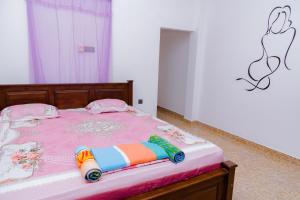 Postel nebo postele na pokoji v ubytování Charith Guest + 16 fotografií