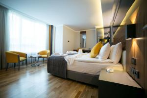 Ένα ή περισσότερα κρεβάτια σε δωμάτιο στο Ankacity Suit Flat