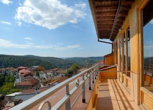 a balcony with a view of a city at Hotel Comfort in Veliko Tŭrnovo
