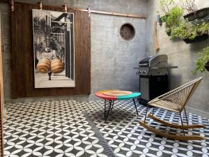 a patio with a table and chairs and a stove at Luxury 2BR House with Ocean View in Castillogrande in Cartagena de Indias +14 photos