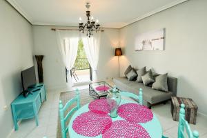 a living room with a table and a couch at Apartment Maritime in La Mata