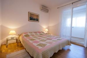 Postel nebo postele na pokoji v ubytování Apartment Parenzana