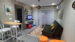 TV a/nebo společenská místnost v ubytování Appartement Cosy + 8 fotografií