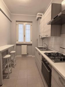 Kuchyň nebo kuchyňský kout v ubytování SNG Home Crema + 1 fotografie