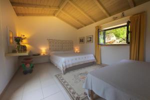A bed or beds in a room at LI PIREDDI
