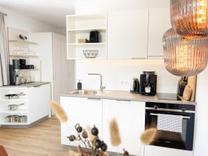 Kuchyň nebo kuchyňský kout v ubytování PAM Apartments