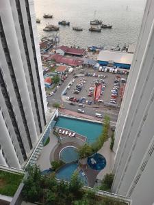 an aerial view of a parking lot with a pool at MC homes in Kota Kinabalu