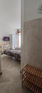 Ένα ή περισσότερα κρεβάτια σε δωμάτιο στο Casalmare Sabina