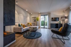 TV/trung tâm giải trí tại Büchelbergerei - Chaletdorf Altmühlsee-Brombachsee +67 ảnh