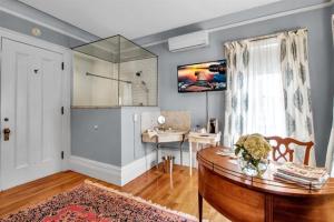a living room with a table and a window at InnBuffalo Off Elmwood in Buffalo +60 photos