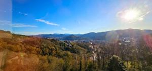 a view of a city from a hill at Hotel Artxanda Bilbao, Parking Gratuito en el Exterior Junto al Hotel in Bilbao