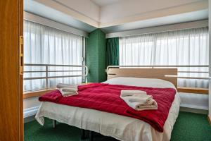 Giường trong phòng chung tại Casa Roby al centro delle Dolomiti