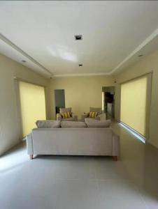 a living room with a couch in a large room at Chalet Sebastian II in Pinamar