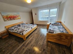 Postel nebo postele na pokoji v ubytování Apartmány Stará Voda