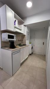 Η κουζίνα ή μικρή κουζίνα στο Apartamentos Costavigia -Mar de Dunas-