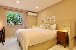 Кровать или кровати в номере Faro Norte Suites