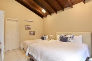 Кровать или кровати в номере Faro Norte Suites
