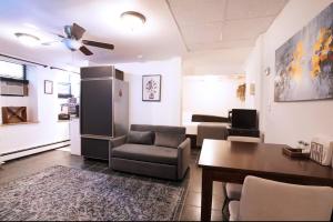 a living room with a couch and a table at City Gem in Long Island City