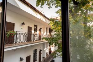 a view of a balcony from a window at Sir Toby's Midtown in Prague