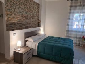A bed or beds in a room at Lido Venere Affittacamere