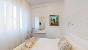 Posteľ alebo postele v izbe v ubytovaní Hotel Ligure