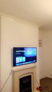 TV a/nebo společenská místnost v ubytování Kay Dynamics