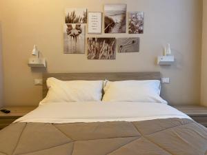 Postel nebo postele na pokoji v ubytování B&b Porta Arpana- Camere & Appartamenti Deluxe in centro