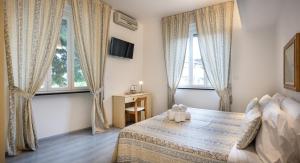 Posteľ alebo postele v izbe v ubytovaní Hotel Ligure