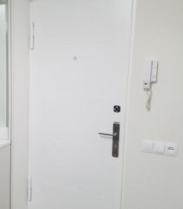 a white door with a lock on it at Very beautiful apartment in Komitas avenue in Yerevan