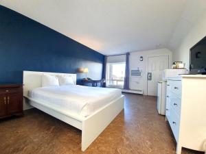 Rúm í herbergi á Cloud 9 Inn