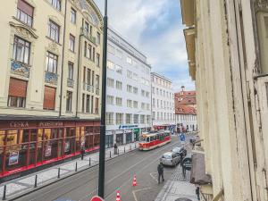 a view of a city street with a bus at Korea town in Prague