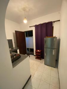 a kitchen with a refrigerator in a room at BE MY Guest in Mirissa
