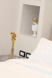 เตียงในห้องที่ Elite Hotel