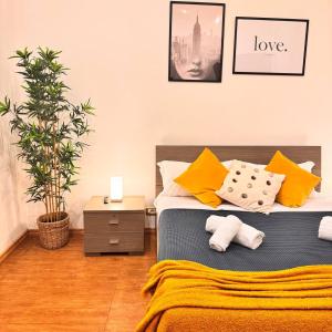 En eller flere senge i et værelse på Charming Home in Termini