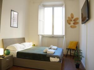 En eller flere senge i et værelse på Charming Home in Termini + 71 billeder