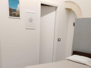 Postel nebo postele na pokoji v ubytování KiMia Home, Centro