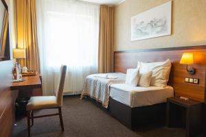 Postel nebo postele na pokoji v ubytování PREMIUM Business Hotel Bratislava