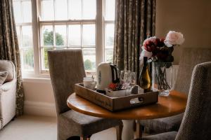 a table with a box on it with flowers on it at Gallows Hill in Scarborough