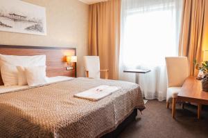 Postel nebo postele na pokoji v ubytování PREMIUM Business Hotel Bratislava