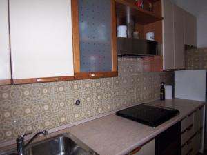 a kitchen with a sink and a counter top at Bella Vista Apartment in Venice