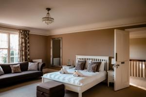 a bedroom with a bed and a couch at Gallows Hill in Scarborough