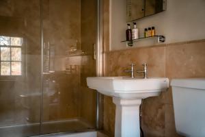 a bathroom with a sink and a shower at Gallows Hill in Scarborough
