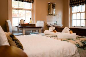 a bedroom with a bed with two stuffed animals on it at Gallows Hill in Scarborough