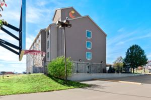 a building with a basketball hoop in front of it at Comfort Inn & Suites in Elk City
