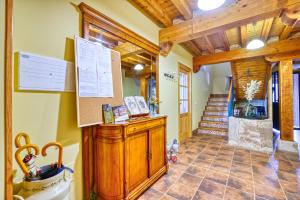 a bathroom with a wooden cabinet and a staircase at El Guarda in Sequera de Fresno +57 photos