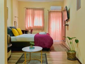 Postel nebo postele na pokoji v ubytování Urban Boutique Hotel