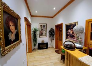 a room with a painting of a girl on the wall at Alsara Guesthouse in Gjirokastër