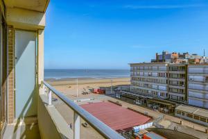 a view of the beach from the balcony of a building at Hermes 3-0505 P in Sint-Idesbald