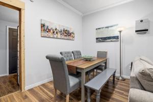 a dining room with a table and chairs at Creekside Cabin - Beaver Lake Creek Access in Rogers